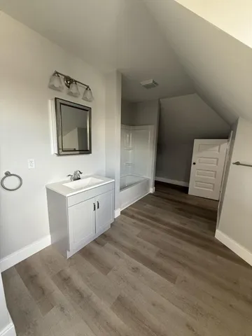 a view of washer and dryer with wooden floor