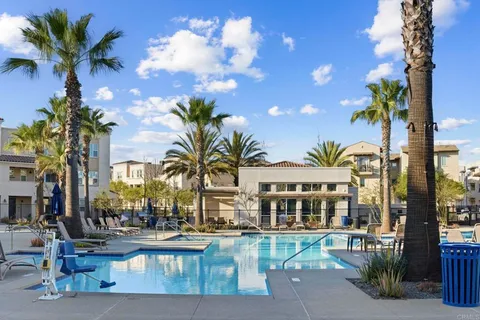 a view of a swimming pool with a table and chairs