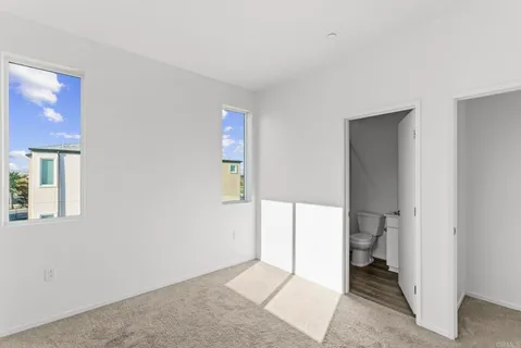 a bathroom with a sink toilet tub vanity and shower