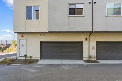 a view of a patio with a table and chairs