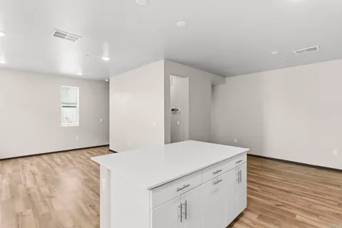 a room with a hardwood and hallway