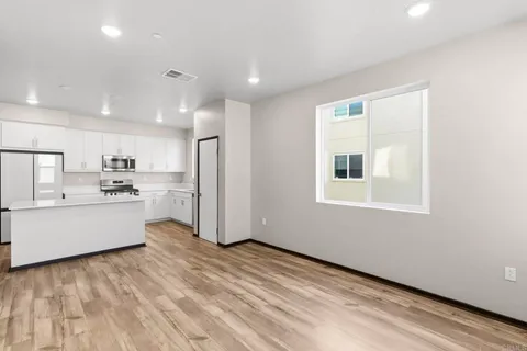a kitchen with stainless steel appliances a refrigerator and a sink