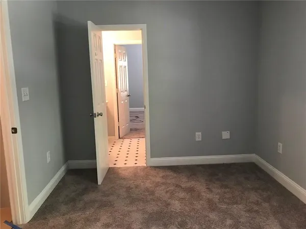 an empty room that has a window