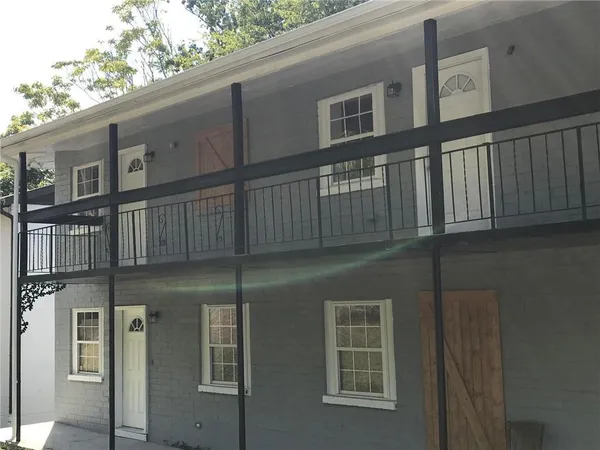 a view of a building with a yard