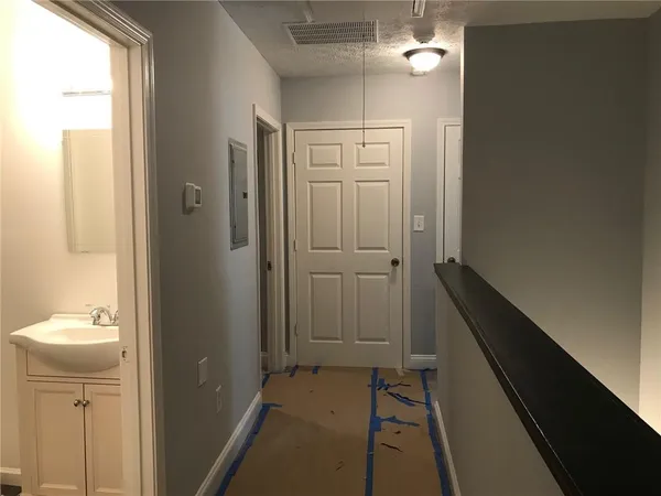 a bathroom with a sink and mirror