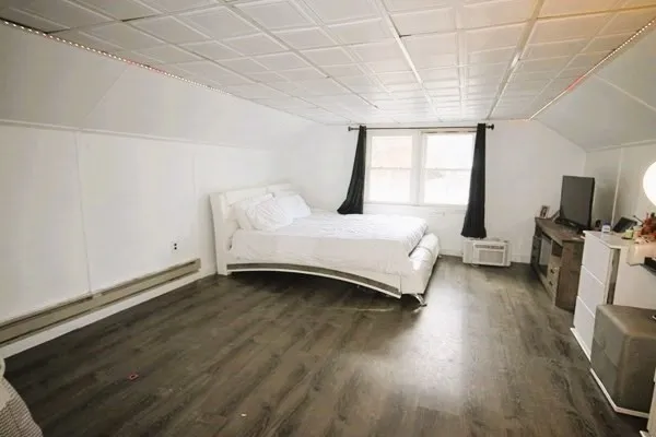 a bathroom with a bathtub and shower