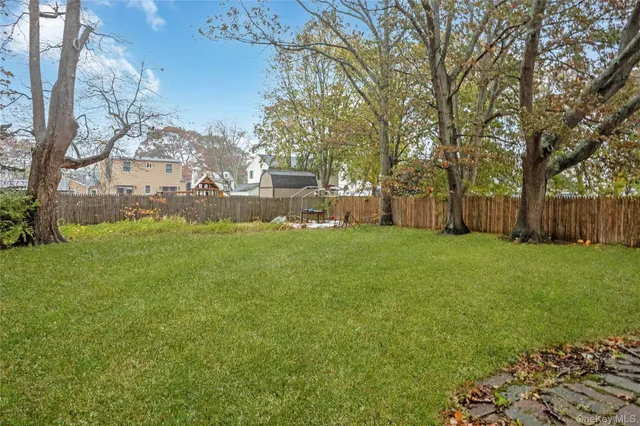 a view of a park with large trees