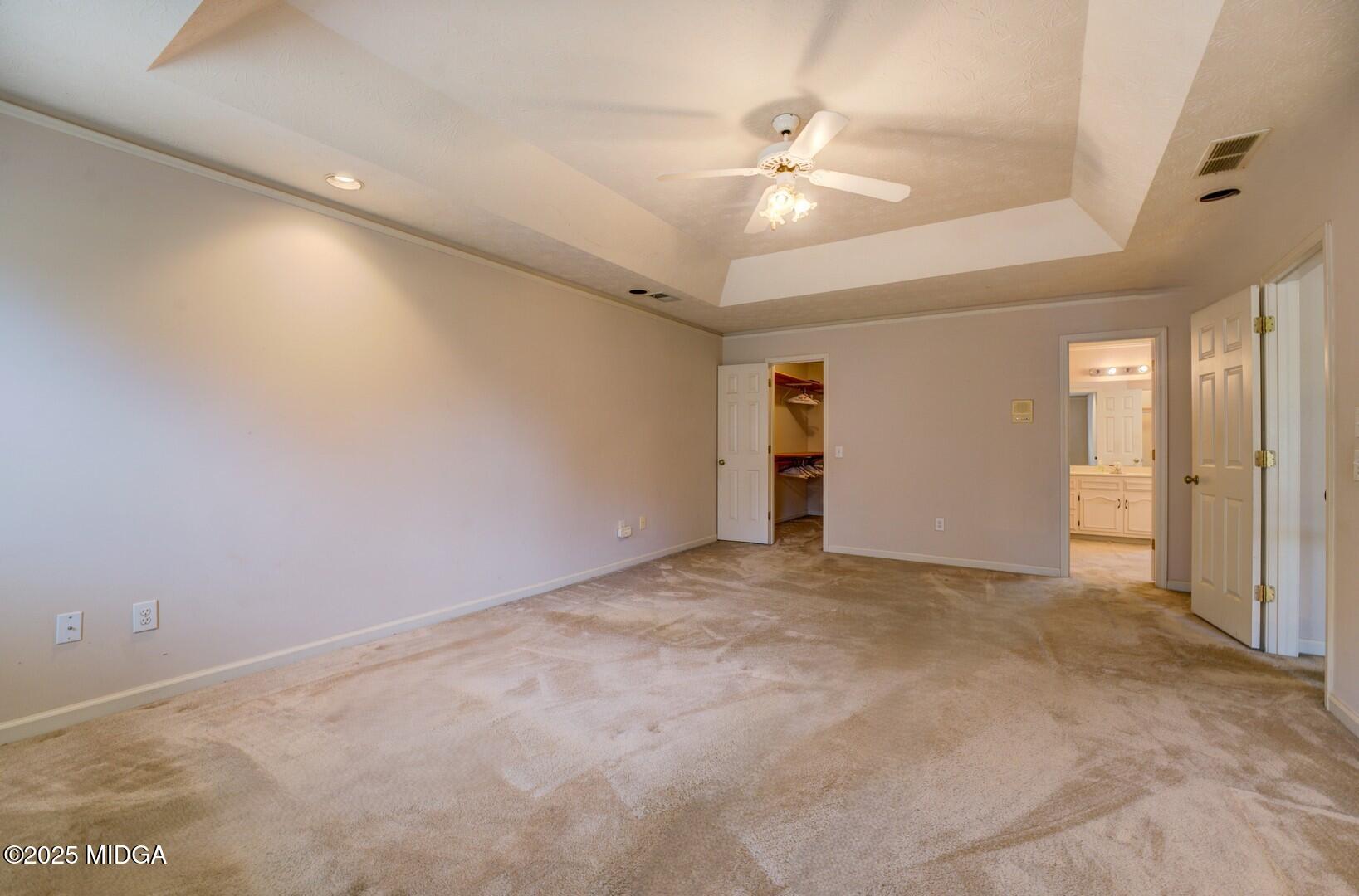 5633 Fox Den Trail Lithonia, GA 30038 - Photo 23 of 44 an empty room with an entryway and fan
