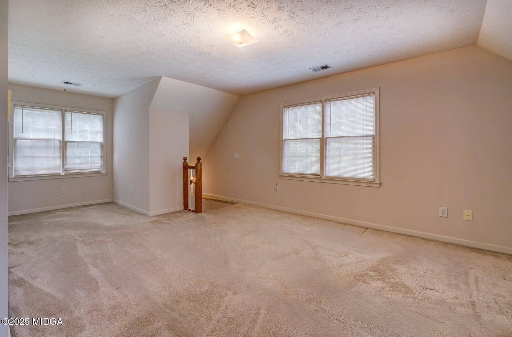 5633 Fox Den Trail Lithonia, GA 30038 - Photo 30 of 44 an empty room with windows and closet
