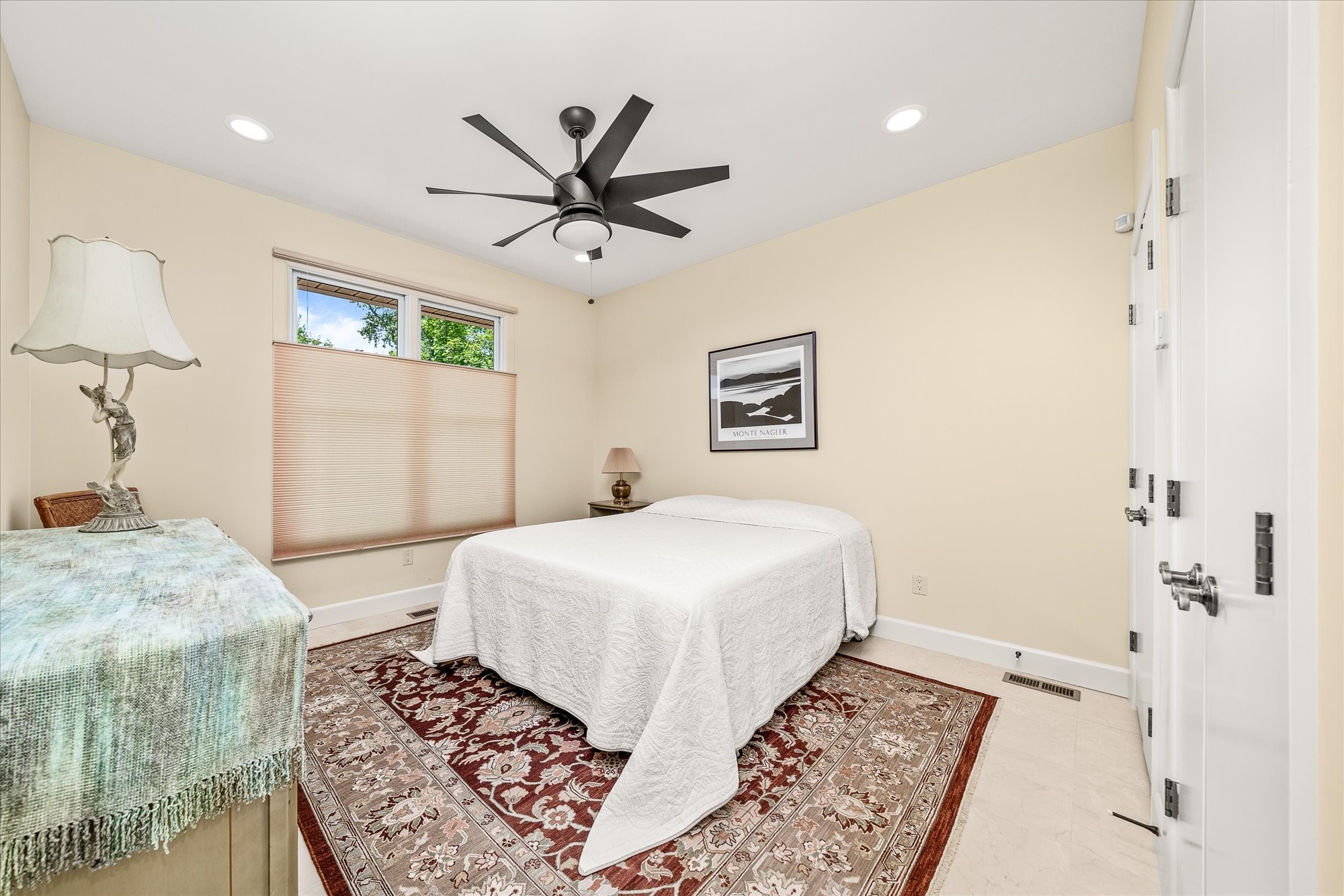 61 Bluff View Terrace Crossville, TN 38558 - Photo 55 of 81 a bedroom with a large bed and a chandelier