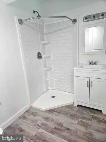 a bathroom with a sink a mirror and a bathtub