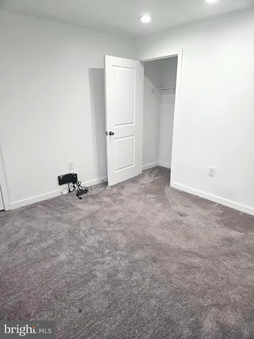 a view of a room with a refrigerator and a sink