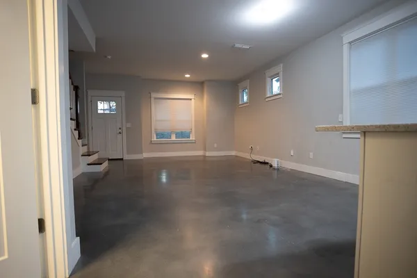a view of a hallway with wooden shelves