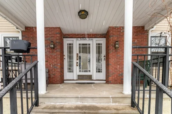a front view of a house with stairs