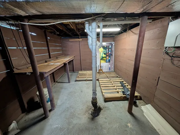a view of an empty room with stairs