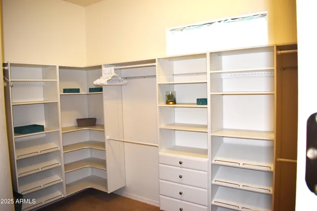 a view of an empty walk in closet