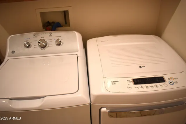 a utility room with dryer and washer