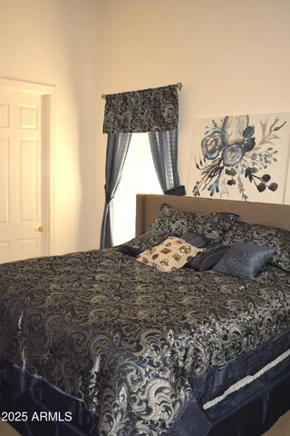 a view of a dining room with furniture and window