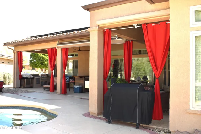a view of a balcony with furniture and walk in closet
