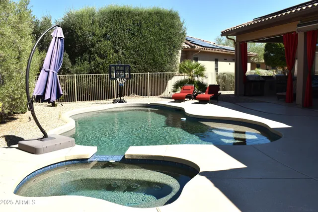 a view of a swimming pool with a patio