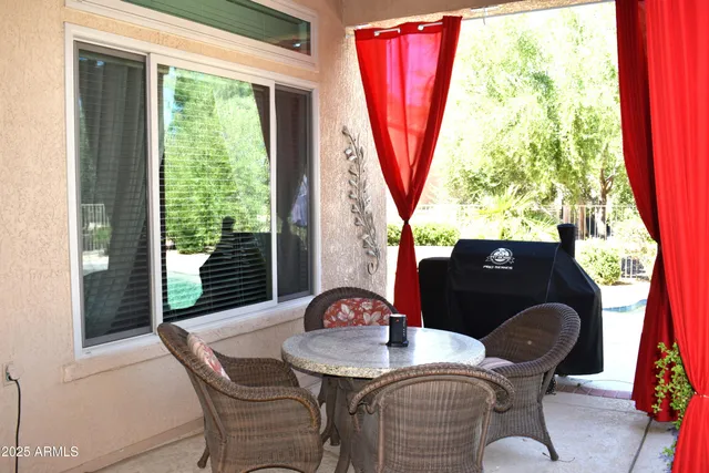 a front view of a building with palm tree