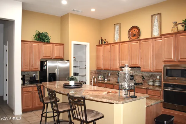 a kitchen with a table and chairs