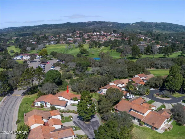 an aerial view of residential houses and outdoor space