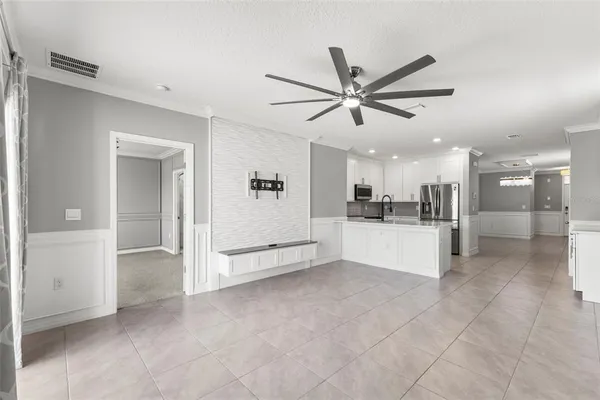 a view of a livingroom with a kitchen