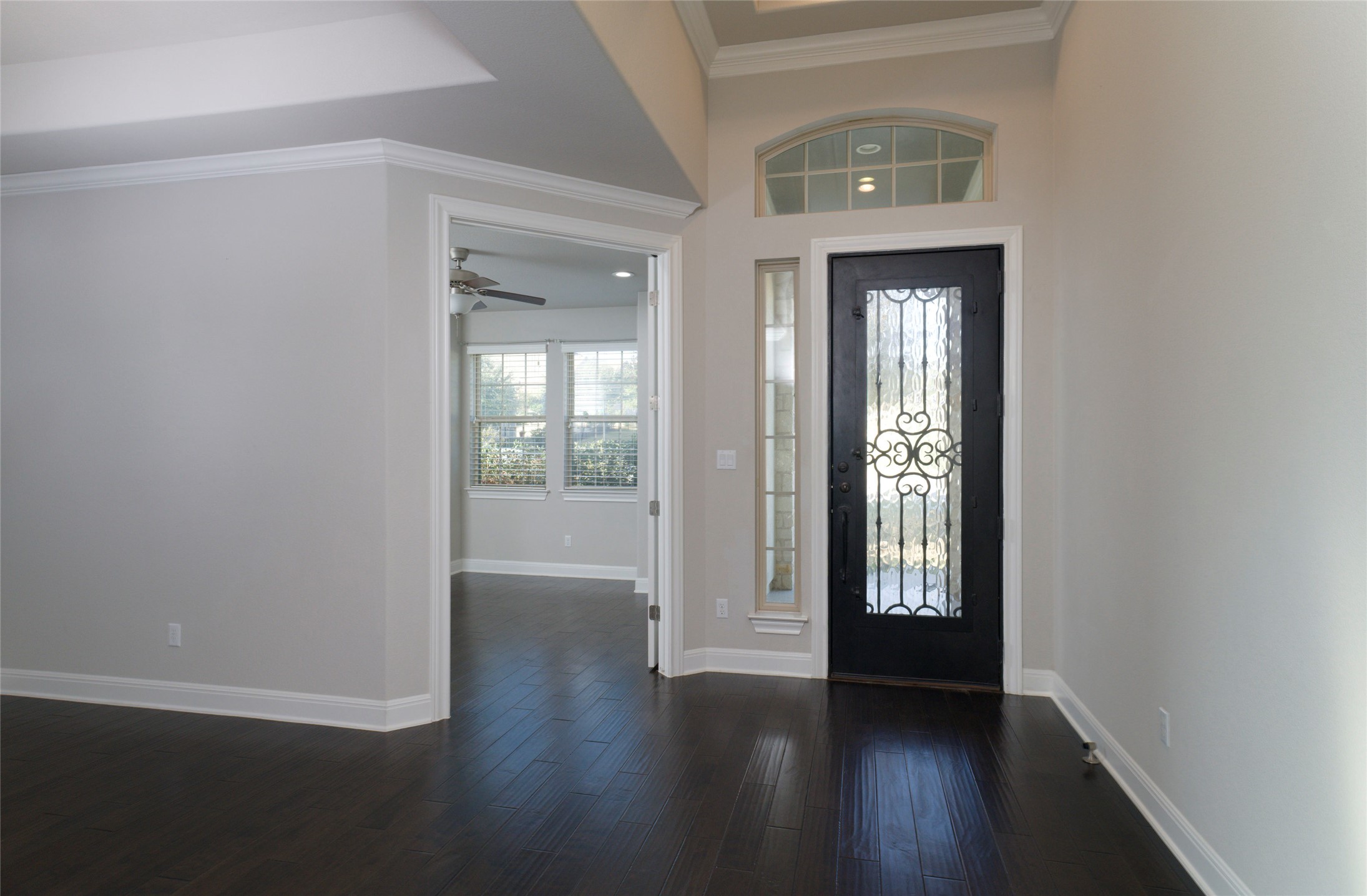 4001 Goodnight Trail Leander, TX 78641 - Photo 4 of 35 an empty room with wooden floor and a window