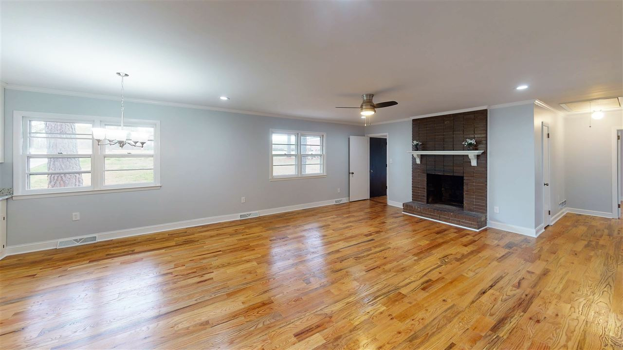 108 Rand Road Raleigh, NC 27603 - Photo 4 of 29 New hardwood floors, ceiling fan, light fixtures and fresh paint make this room the center of excitement. Great place to make memories. Cozy fireplace for winter weather. Family Room