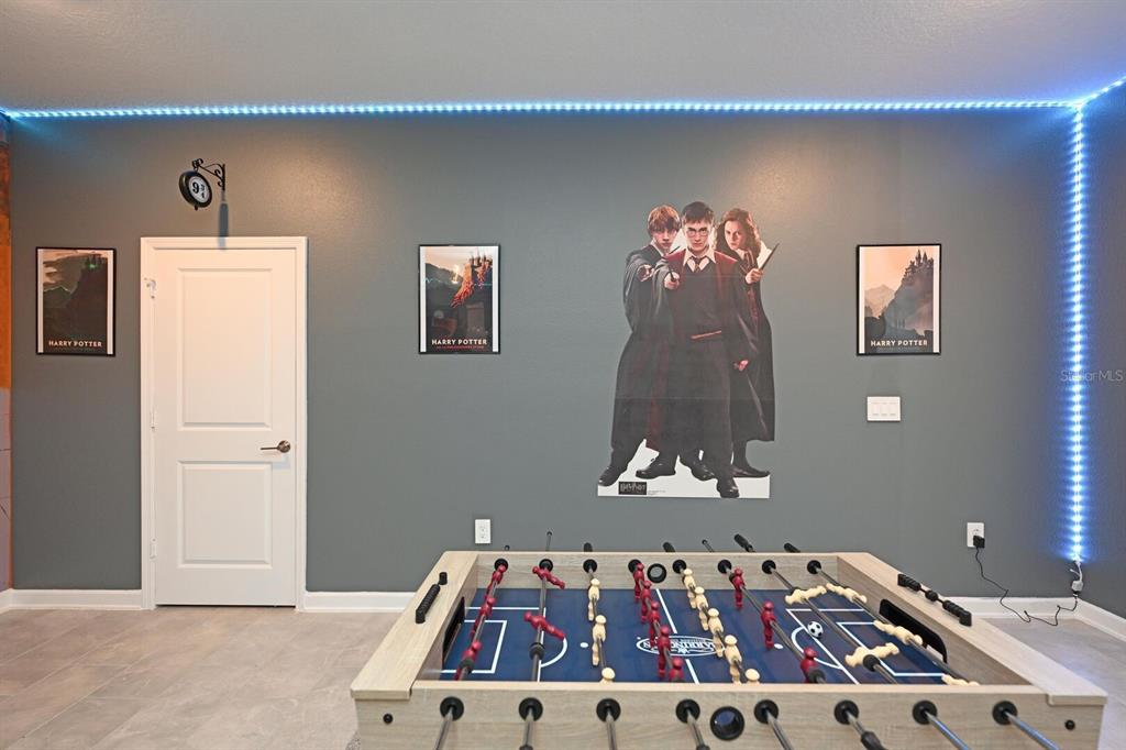 2956 Penelope Loop Kissimmee, FL 34746 - Photo 16 of 94 a bedroom with a bed and a painting on the wall