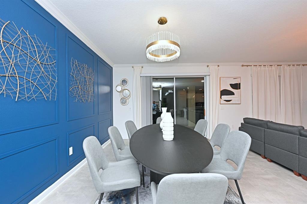 2956 Penelope Loop Kissimmee, FL 34746 - Photo 27 of 94 a dining room with furniture and window