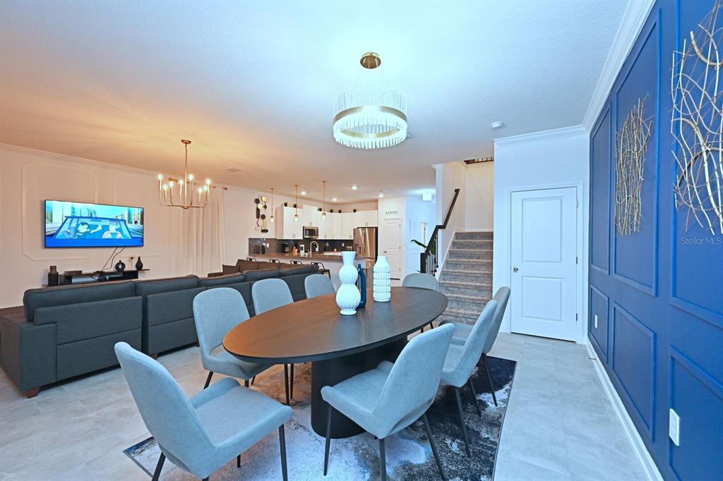 2956 Penelope Loop Kissimmee, FL 34746 - Photo 5 of 94 a view of a dining room with furniture