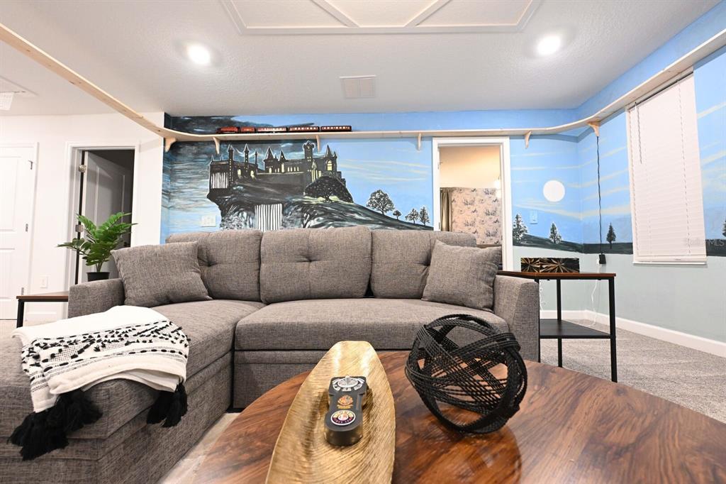 2956 Penelope Loop Kissimmee, FL 34746 - Photo 52 of 94 a view of a livingroom with furniture and wooden floor