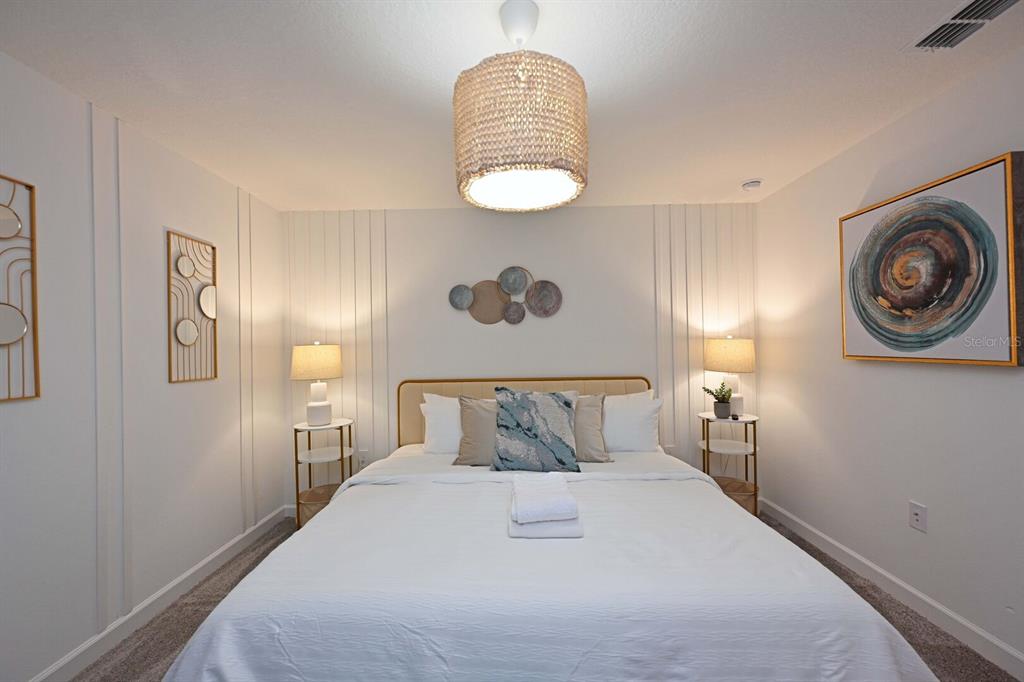 2956 Penelope Loop Kissimmee, FL 34746 - Photo 54 of 94 a bedroom with a bed and a window