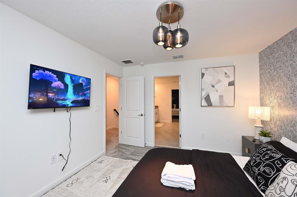 2956 Penelope Loop Kissimmee, FL 34746 - Photo 57 of 94 a living room with furniture and a window