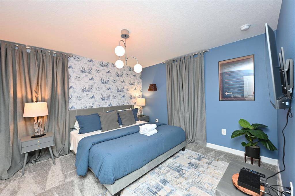 2956 Penelope Loop Kissimmee, FL 34746 - Photo 67 of 94 a bedroom with a bed potted plant with the outer view