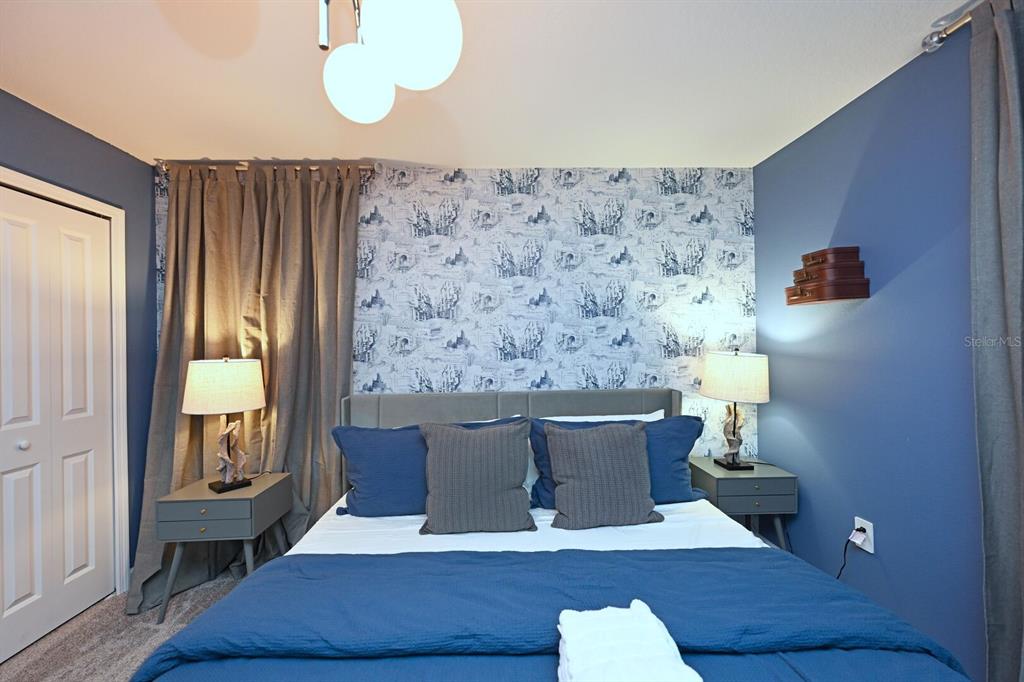 2956 Penelope Loop Kissimmee, FL 34746 - Photo 68 of 94 a view of a dining room with furniture and wooden floor