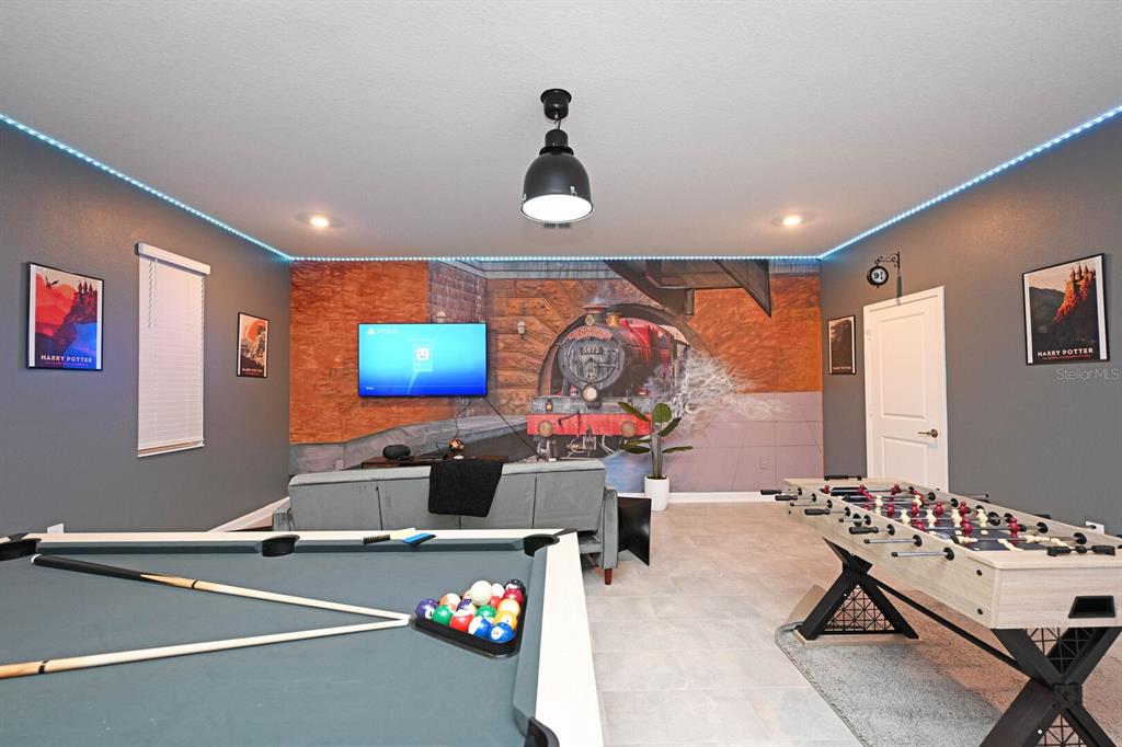 2956 Penelope Loop Kissimmee, FL 34746 - Photo 7 of 94 a room with furniture and air hockey table