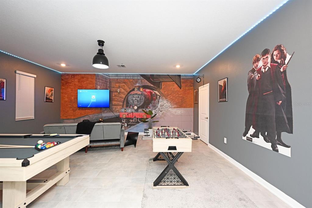 2956 Penelope Loop Kissimmee, FL 34746 - Photo 8 of 94 a living room with furniture and a flat screen tv