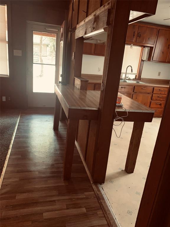 7046 Camp Street Azle, TX 76020 - Photo 12 of 26 a view of entryway and hall with wooden floor