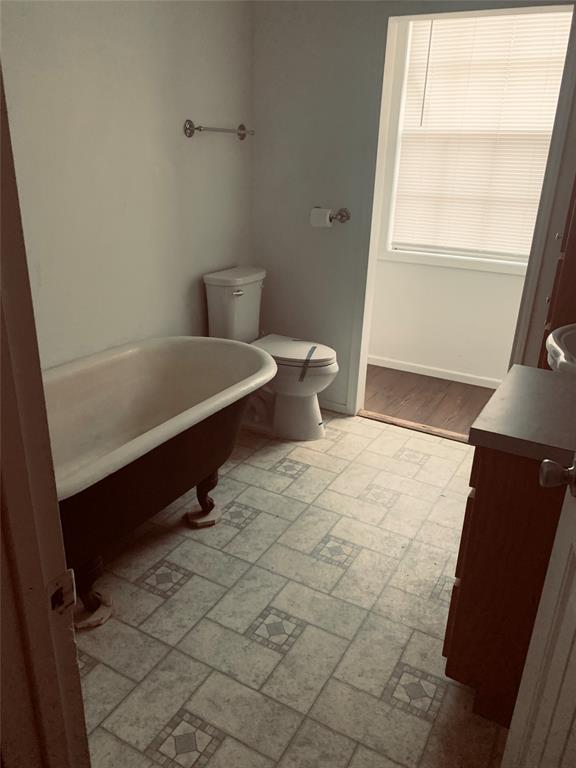 7046 Camp Street Azle, TX 76020 - Photo 17 of 26 a bathroom with a sink and a vanity