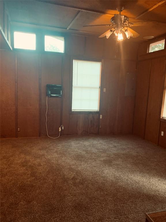 7046 Camp Street Azle, TX 76020 - Photo 18 of 26 a view of an empty room with window and chandelier fan