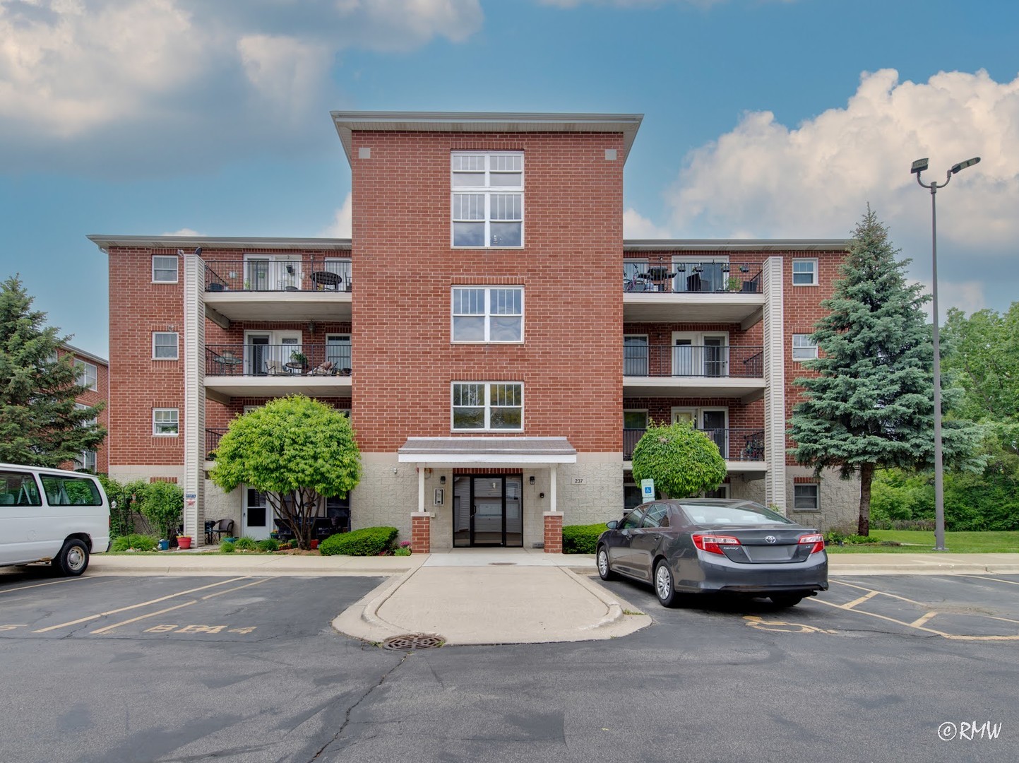 a car parked in front of a brick building