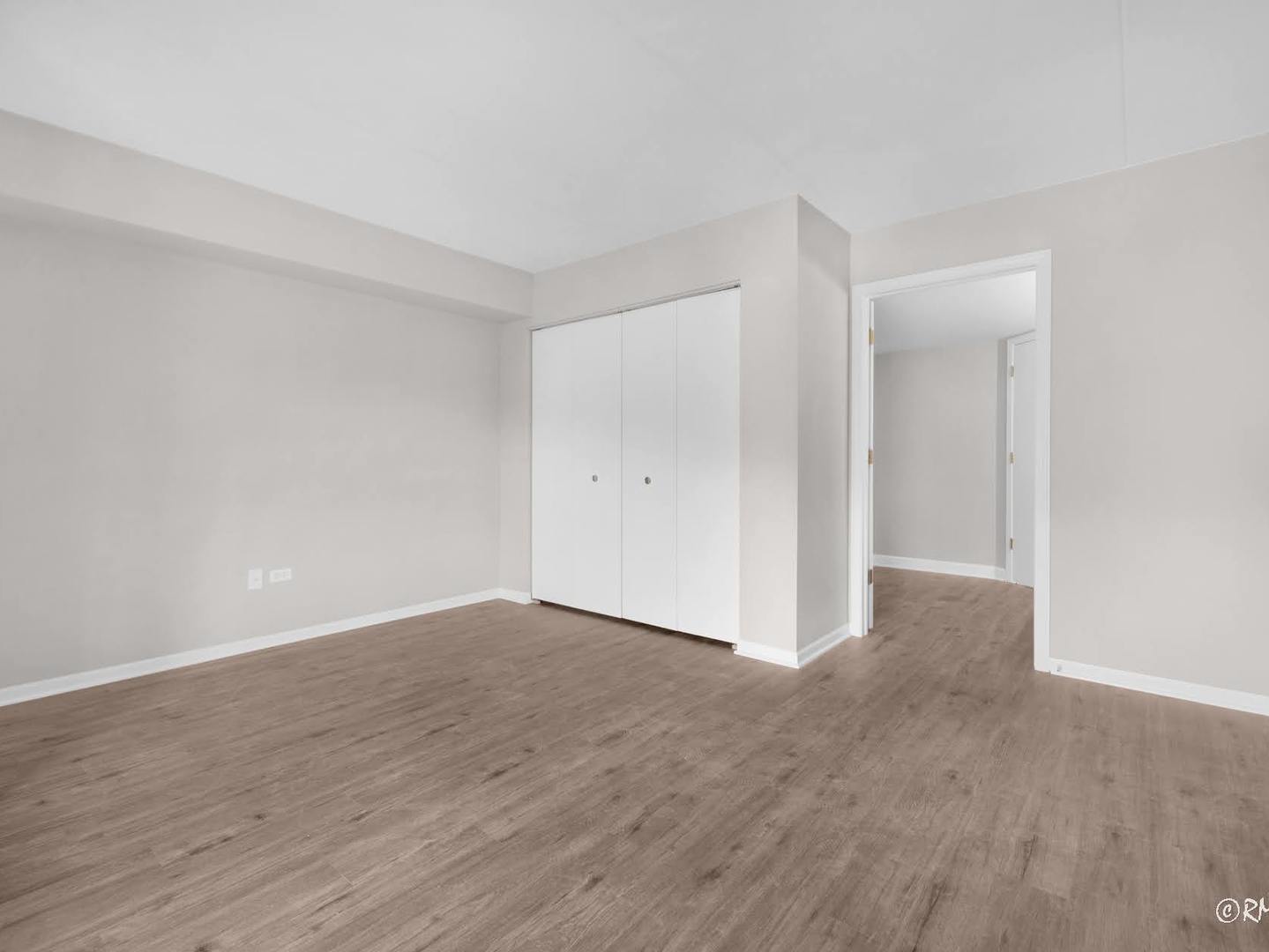 237 North Mill Road, Unit 12 Addison, IL 60101 - Photo 14 of 21 a view of an empty room and wooden floor