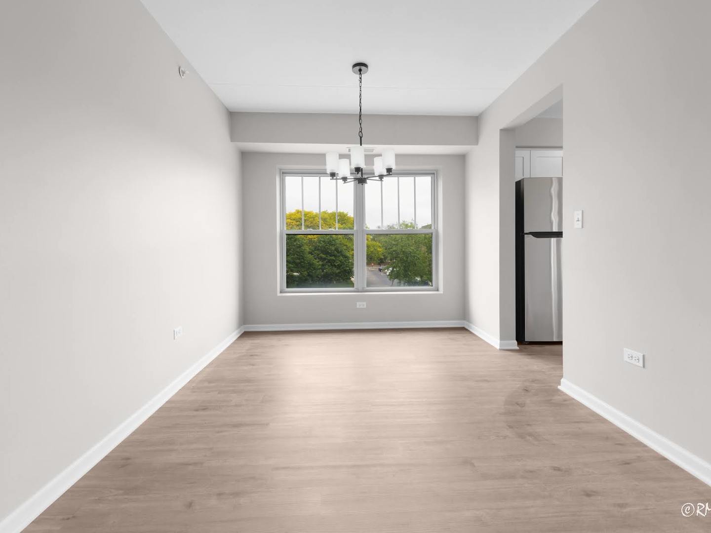 237 North Mill Road, Unit 12 Addison, IL 60101 - Photo 5 of 21 an empty room with windows and outdoor view