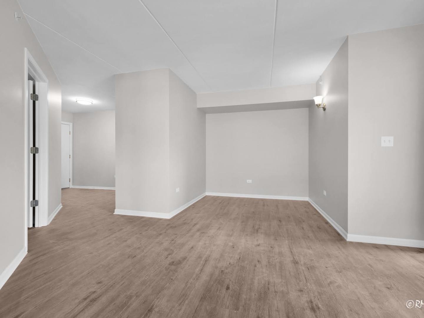 237 North Mill Road, Unit 12 Addison, IL 60101 - Photo 7 of 21 a view of an empty room with wooden floor