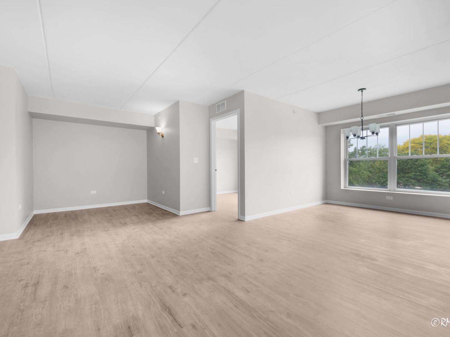 237 North Mill Road, Unit 12 Addison, IL 60101 - Photo 8 of 21 a view of an empty room with a window