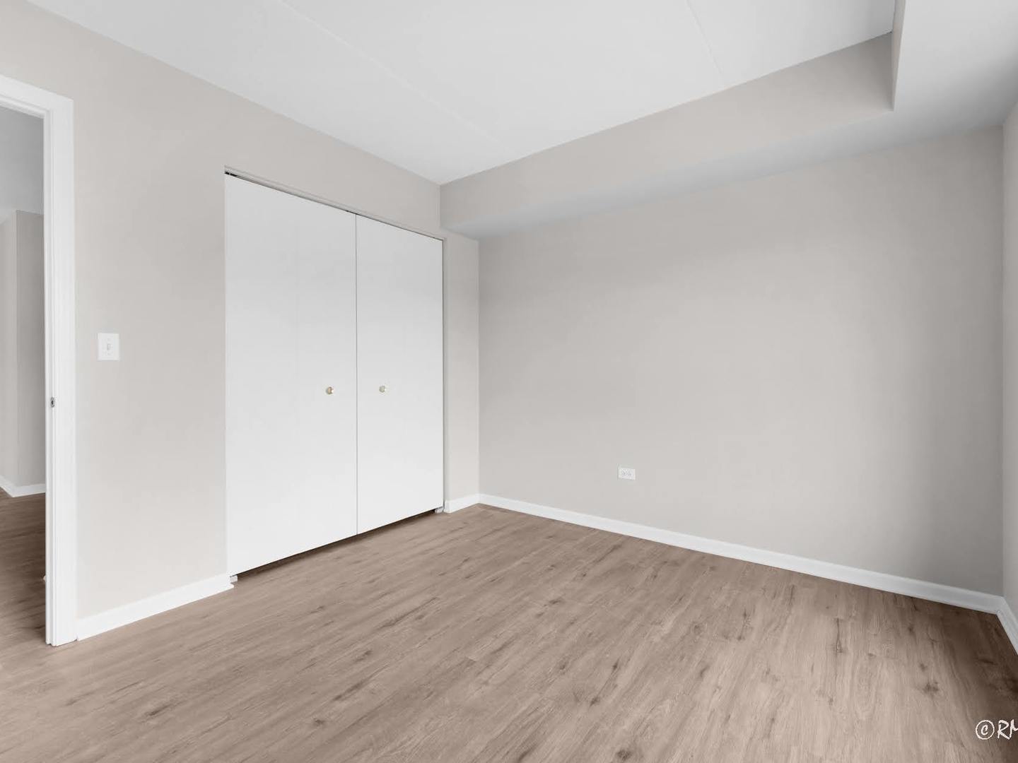 237 North Mill Road, Unit 12 Addison, IL 60101 - Photo 10 of 21 a view of an empty room with wooden floor