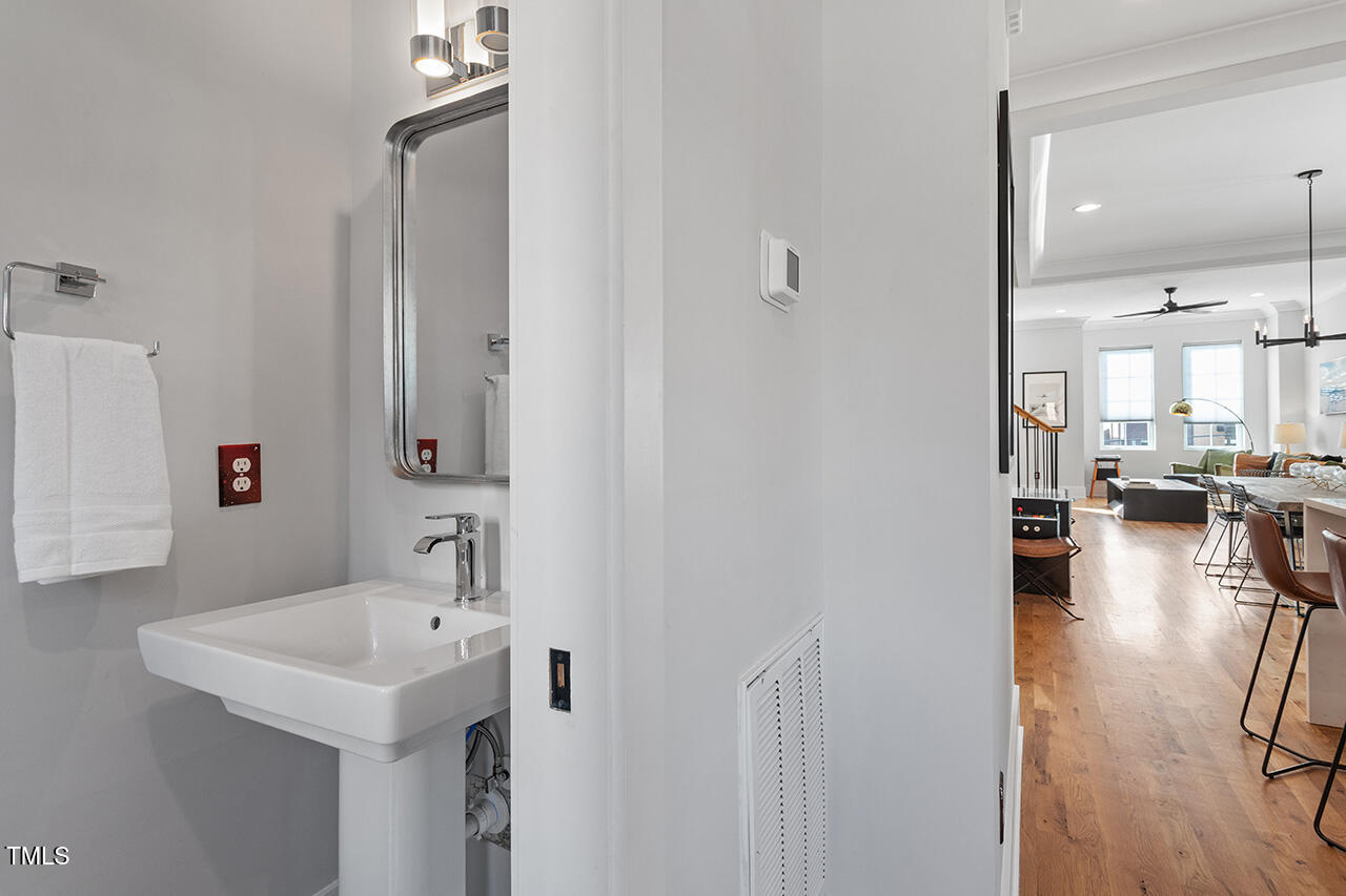 613 South West Street Raleigh, NC 27601 - Photo 16 of 36 a en suite bathroom with a sink and a mirror